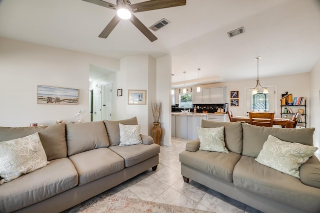 living area with visible vents and a ceiling fan