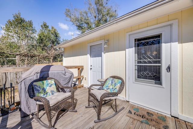 wooden deck featuring fence