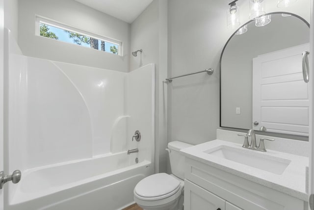 full bathroom with bathing tub / shower combination, vanity, and toilet