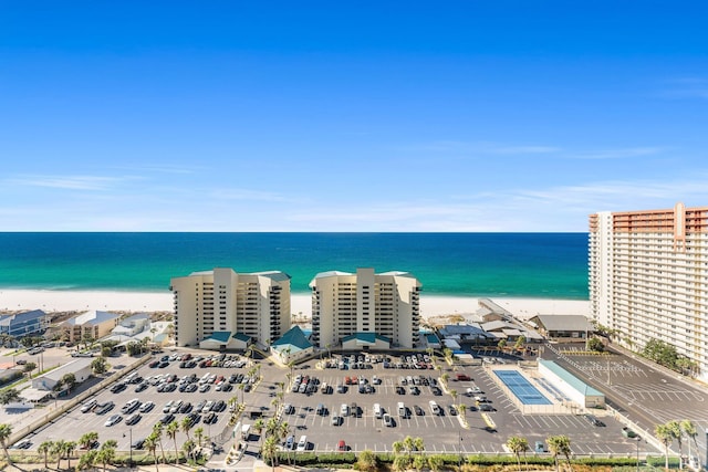 drone / aerial view featuring a water view and a view of the beach