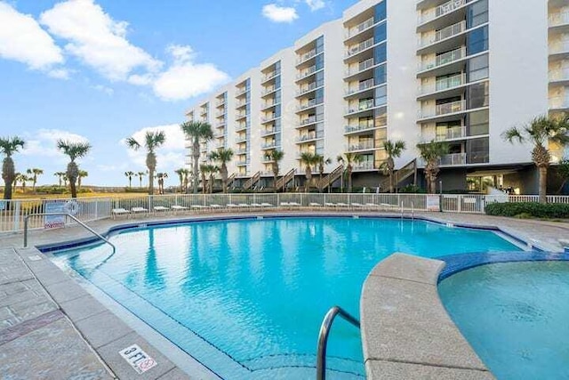 community pool featuring fence