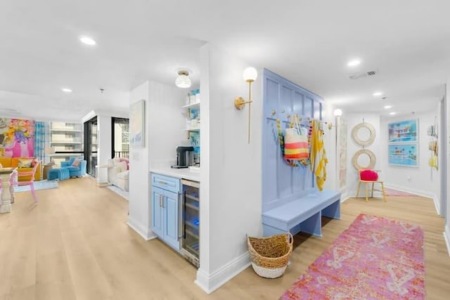 mudroom featuring baseboards, visible vents, wine cooler, light wood-style floors, and recessed lighting