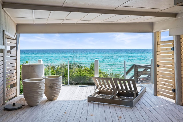 wooden deck with a water view