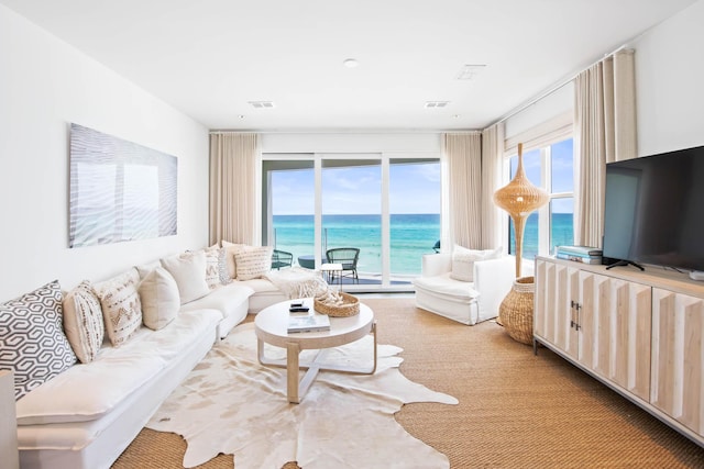 living room with visible vents and carpet flooring