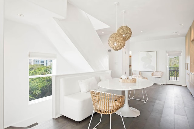 dining space with recessed lighting, visible vents, and wood finished floors