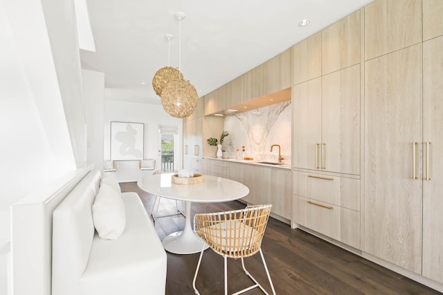 dining space featuring dark wood-style floors