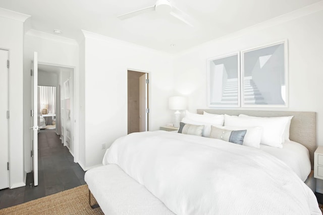 bedroom featuring ornamental molding, ceiling fan, baseboards, and dark wood-style floors