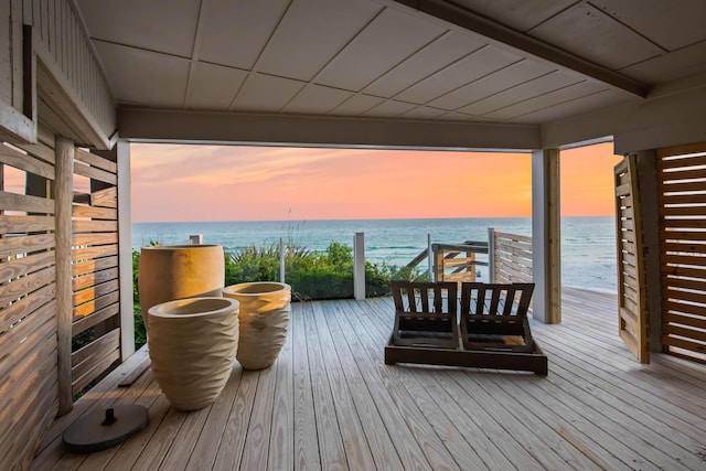 wooden deck with a water view