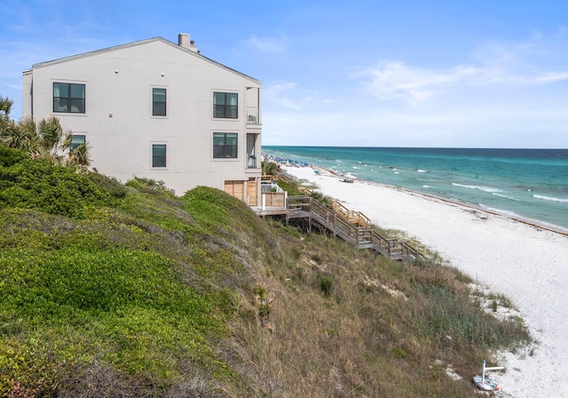 property view of water featuring a beach view