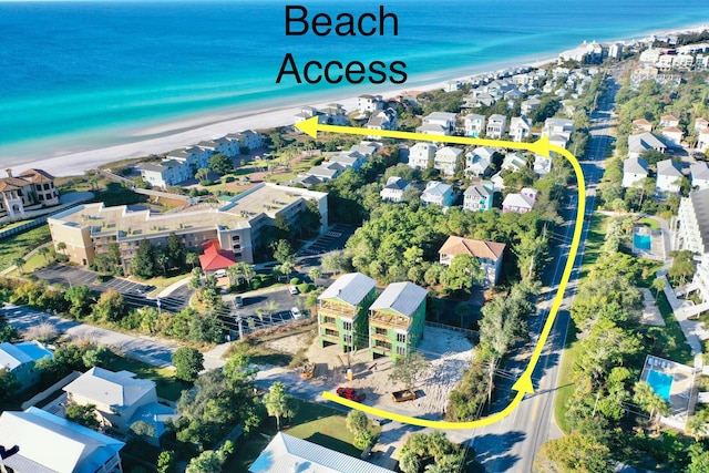 bird's eye view featuring a residential view, a beach view, and a water view