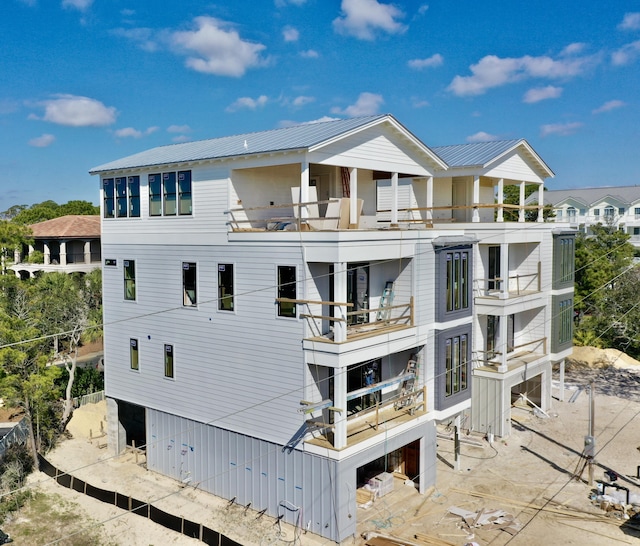 rear view of house featuring metal roof