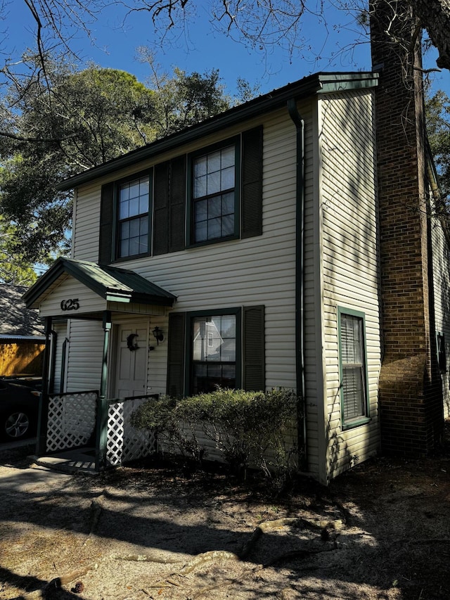 view of front of home with a chimney