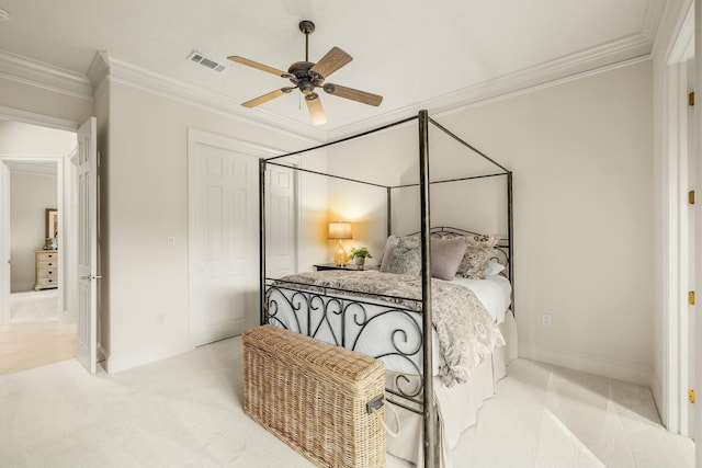 bedroom featuring ornamental molding, light carpet, visible vents, and baseboards