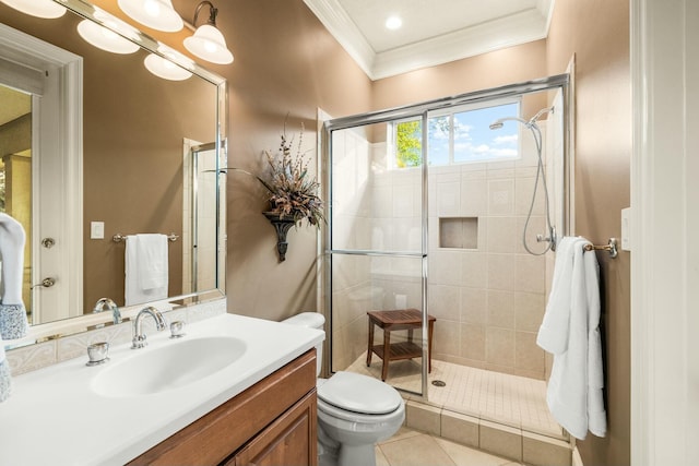 bathroom featuring ornamental molding, a stall shower, vanity, and toilet