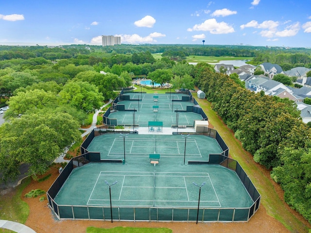 view of tennis court featuring fence