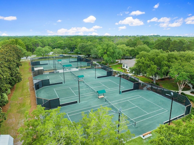 bird's eye view featuring a wooded view