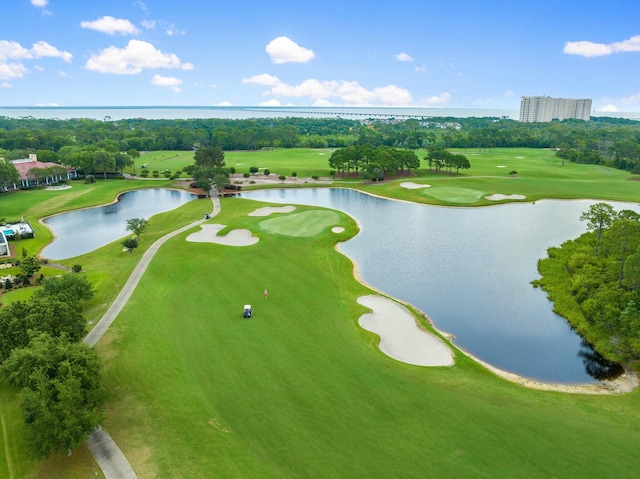 bird's eye view with a water view and golf course view