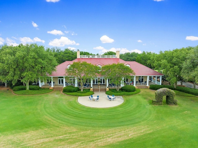 exterior space featuring driveway and a lawn