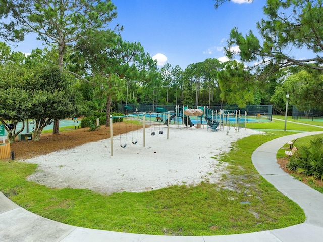 surrounding community with playground community and fence