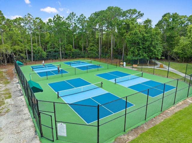 view of tennis court featuring fence