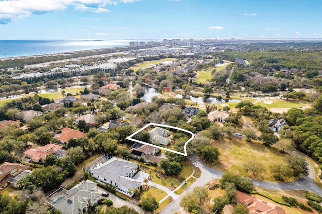 birds eye view of property with a water view and a residential view