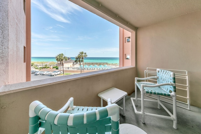 balcony featuring a water view