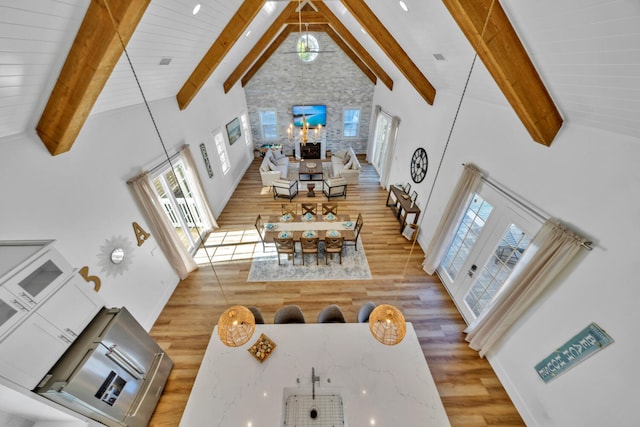 54 Vicki St, Santa Rosa Beach, FL 32459 - living room with beam ceiling, wood finished floors, a wealth of natural light, and high vaulted ceiling