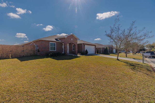 view of front facade featuring a garage, brick siding, fence, concrete driveway, and a front yard