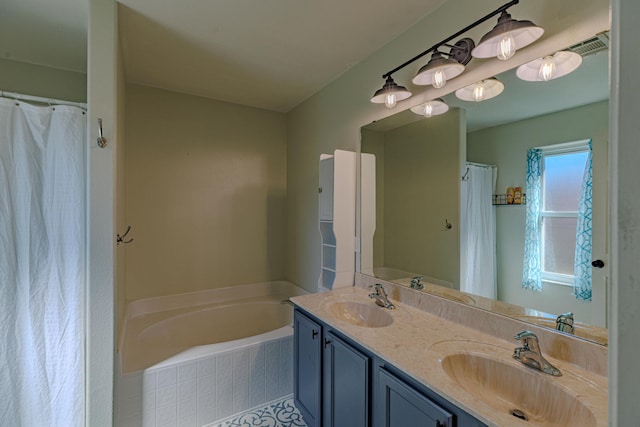 full bath featuring a garden tub, double vanity, and a sink