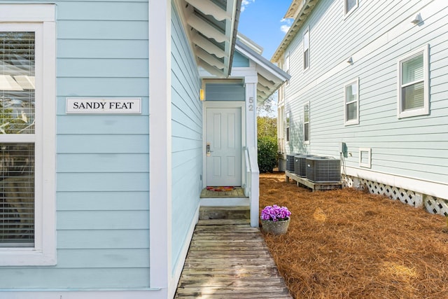 doorway to property with central air condition unit