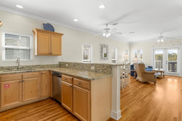 kitchen with dishwasher, light wood-style flooring, a peninsula, crown molding, and a sink