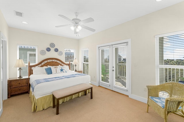 bedroom featuring light colored carpet, access to outside, visible vents, and baseboards