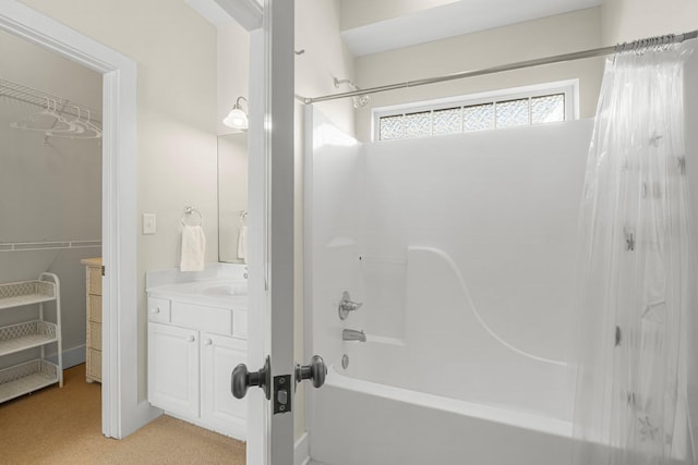 bathroom with shower / tub combo and vanity