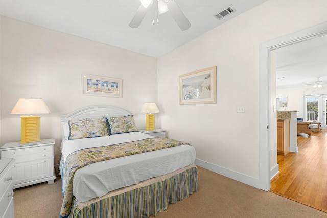 bedroom with ceiling fan, visible vents, and baseboards