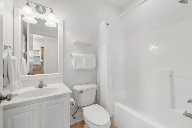 full bath featuring vanity, toilet, and shower / bath combo with shower curtain