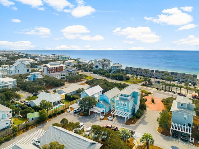 drone / aerial view featuring a water view and a residential view