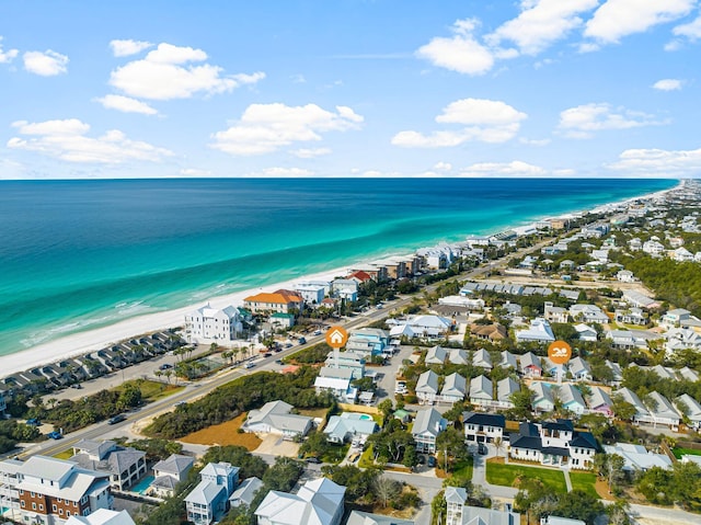 aerial view featuring a residential view, a water view, and a beach view