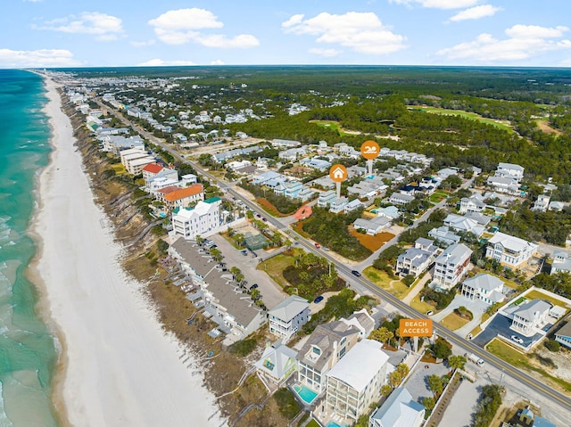 birds eye view of property featuring a water view and a view of the beach