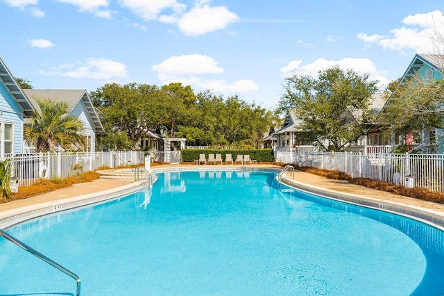 community pool featuring fence