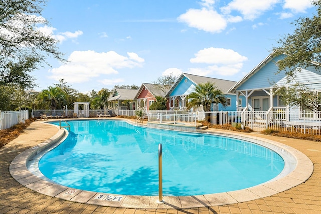 community pool featuring fence