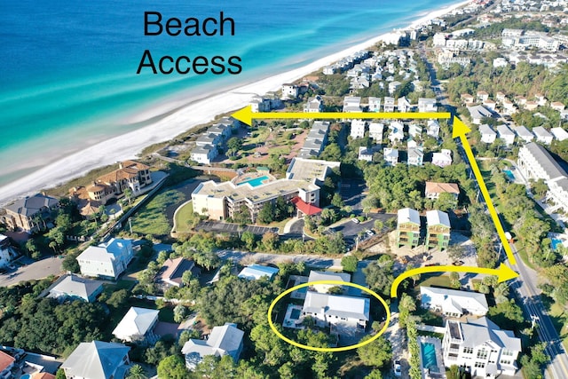 bird's eye view featuring a residential view, a water view, and a view of the beach