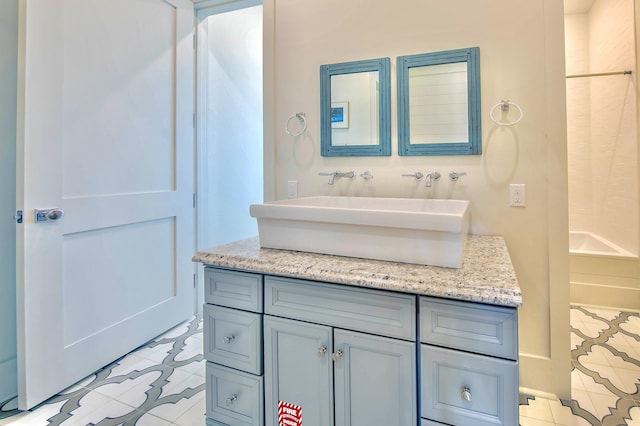 bathroom with tile patterned flooring and vanity