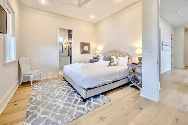 bedroom with recessed lighting, baseboards, connected bathroom, and light wood finished floors