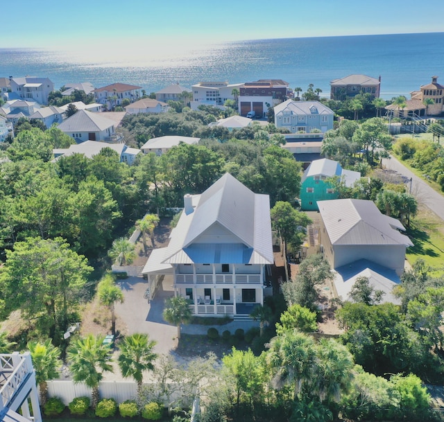 bird's eye view featuring a water view and a residential view