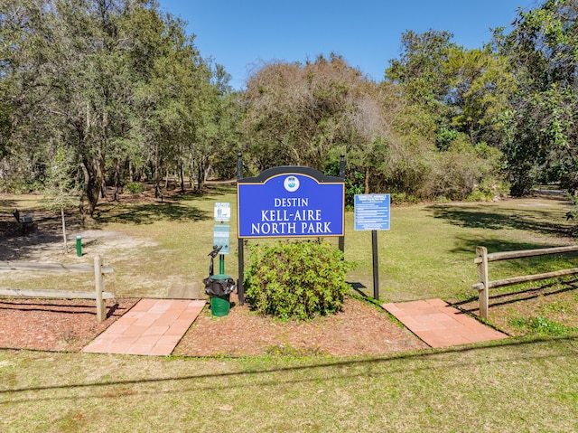 view of home's community featuring a lawn