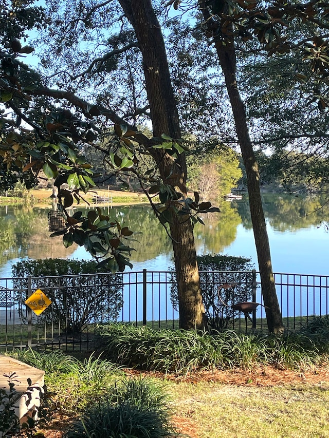 view of water feature with fence