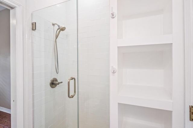 bathroom with a shower stall