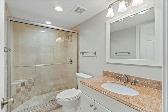 bathroom featuring toilet, recessed lighting, vanity, visible vents, and a stall shower