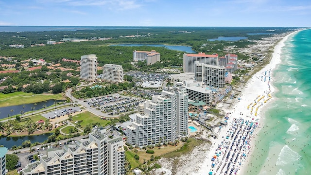 aerial view with a view of the beach, a water view, and a view of city