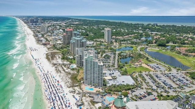 bird's eye view featuring a water view, a view of city, and a view of the beach